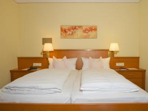 Postel nebo postele na pokoji v ubytování Hotel Pension Fent