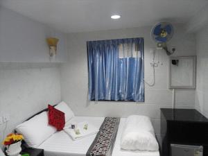 Rúm í herbergi á Singh Guest House
