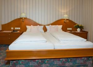 Postel nebo postele na pokoji v ubytování Hotel Pension Fent