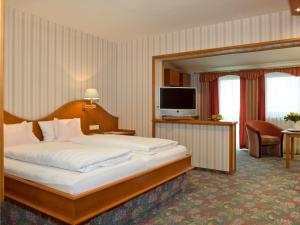 Postel nebo postele na pokoji v ubytování Hotel Pension Fent