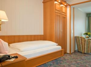 Postel nebo postele na pokoji v ubytování Hotel Pension Fent