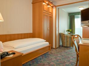 Postel nebo postele na pokoji v ubytování Hotel Pension Fent