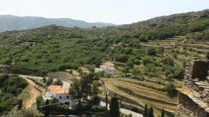 a view of a valley with a house on a hill at Petra Traditional House in Episkopión