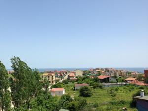 a view of a city with the ocean in the background at Семеен хотел Катерини in Sinemorets