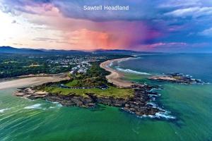 an aerial view of a beach and the ocean at No 5 Rockpool 69 Ave Sawtell in Sawtell