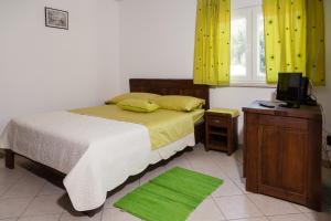 Postel nebo postele na pokoji v ubytování Rooms Vesna + 14 fotografií