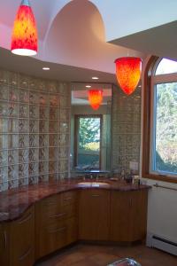 a bathroom with a sink and a mirror at C-Scape in Boutiliers Point