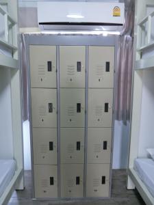 a row of lockers in a room with a ceiling at Patone Hostel in Phra Nakhon Si Ayutthaya