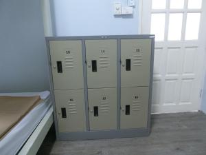 a locker room with four lockers in a room at Patone Hostel in Phra Nakhon Si Ayutthaya