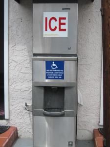 a ice machine sitting outside of a building at Walls Motel Long Beach in Long Beach