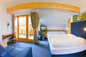 Postel nebo postele na pokoji v ubytování Hotel Lukas