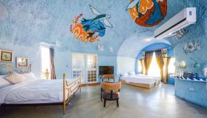 Giường trong phòng chung tại Kenting Ha-Bi Star Fort