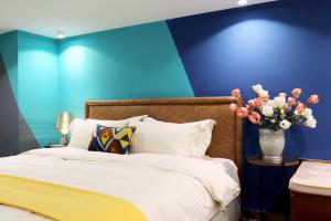 Giường trong phòng chung tại Royal Star Apartment(Guangzhou Central City Branch)