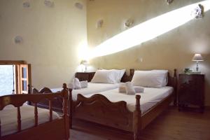 En eller flere senge i et værelse på Mulberry Villa in Armenoi, Chania