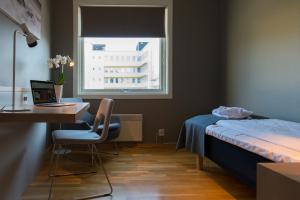 Postel nebo postele na pokoji v ubytování Fast Hotel Svolvær