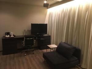 TV a/nebo společenská místnost v ubytování N hotel #NL1