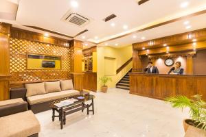 a lobby of a hotel with a reception desk at Hotel Lake Shore in Pokhara