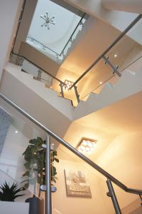 a staircase with a skylight in a building at Garden Top Hotel in Johannesburg