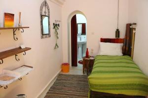 Cama ou camas em um quarto em Dar Zerhoune