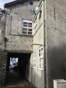 an alley with a building with a window at 2 leather lane in Ulverston