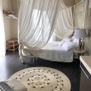 Postel nebo postele na pokoji v ubytování La dimora del Casanova B&B boutique