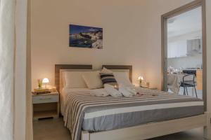 Una cama o camas en una habitación de MareinSicilia: Talia Residence