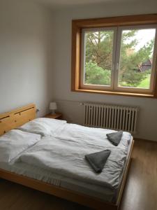 Postel nebo postele na pokoji v ubytování Holiday Park Vrchlabí - Liščí farma