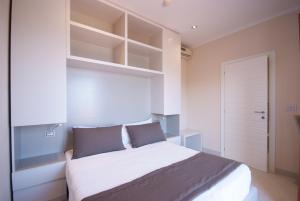 Кровать или кровати в номере Hotel La Perla Del Golfo