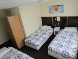 Кровать или кровати в номере Hotel Cafe Woud