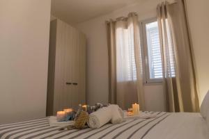 Una cama o camas en una habitación de MareinSicilia: Talia Residence