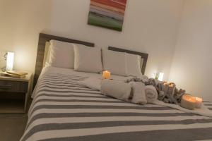 Una cama o camas en una habitación de MareinSicilia: Talia Residence