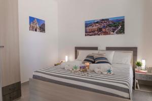 Una cama o camas en una habitación de MareinSicilia: Talia Residence