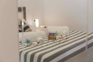 Una cama o camas en una habitación de MareinSicilia: Talia Residence