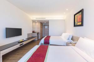 TV a/nebo společenská místnost v ubytování Naruwan Galaxy Hotel