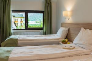 Ένα ή περισσότερα κρεβάτια σε δωμάτιο στο Hotel DADA Termal