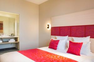 Un ou plusieurs lits dans un hébergement de l'établissement Best Western Plus Hôtel Escapade Senlis
