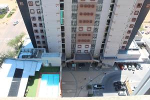 an overhead view of a building with a swimming pool at Pat Luxurious Studio in Gaborone