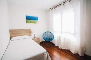 Cama o camas de una habitación en Apartamentos Alday