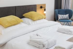 Posteľ alebo postele v izbe v ubytovaní City of the Kings-Silver Apartment No 2- Lubelska 10