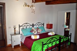 Posteľ alebo postele v izbe v ubytovaní B&B Le Anthos