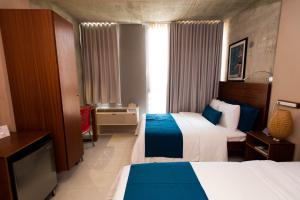 Postel nebo postele na pokoji v ubytování Dream Inn PR