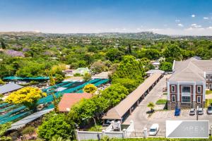 an aerial view of a resort with a swimming pool at The Apex On Smuts in Johannesburg