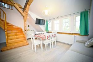 Televízia a/alebo spoločenská miestnosť v ubytovaní Relax Loft Apartment