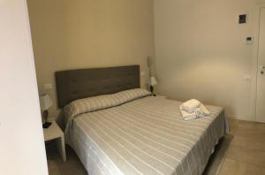 A bed or beds in a room at HOTEL CONDOR
