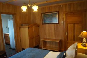 Postel nebo postele na pokoji v ubytování Tradicion Austral Bed & Breakfast