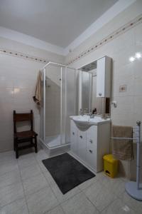 a bathroom with a shower and a sink and a toilet at B&B la Bitta in Cagliari