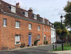 a row of brick houses on a street at St Mary’s Bed & Breakfast in Bury Saint Edmunds