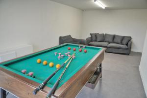 a room with a pool table with balls on it at Vue de Rome in Durbuy