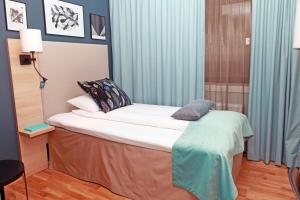 Postel nebo postele na pokoji v ubytování Quality Hotel Grand Steinkjer