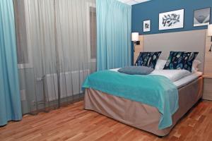 Postel nebo postele na pokoji v ubytování Quality Hotel Grand Steinkjer